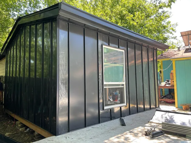 Black standing seam metal wall panels for Roof Inspection in Sudley